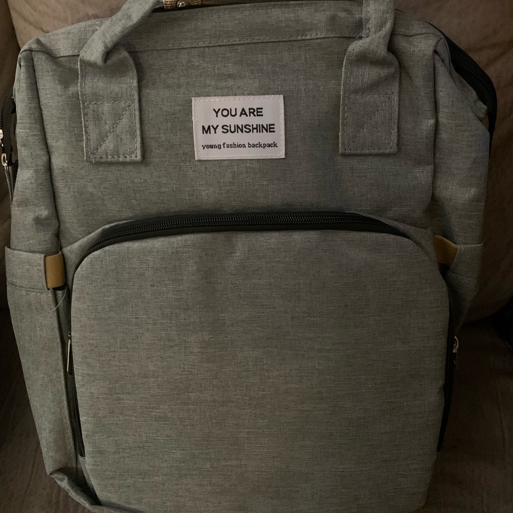 Diaper bag with bassinet